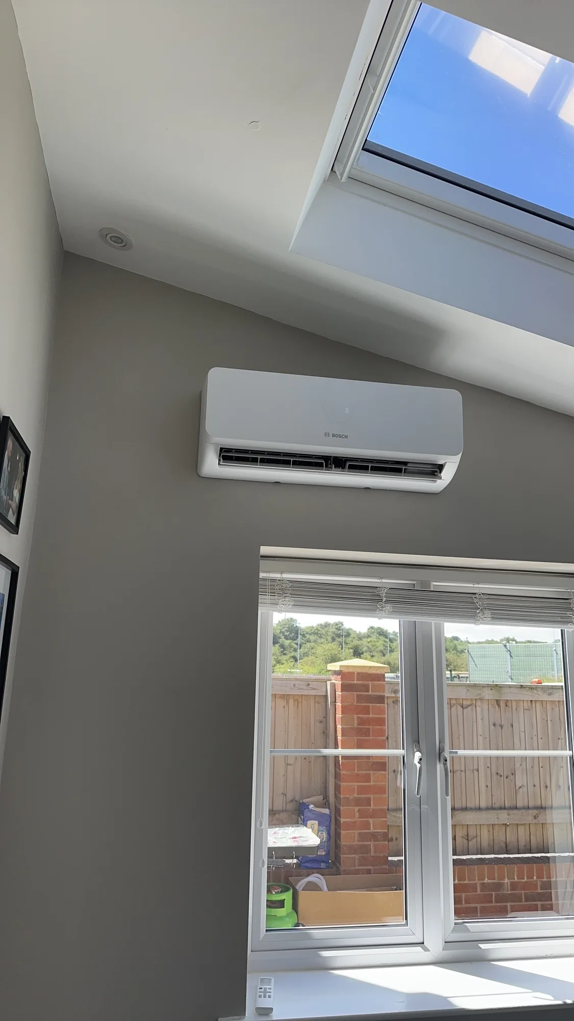 Air conditioning indoor split unit installed beneath a skylight