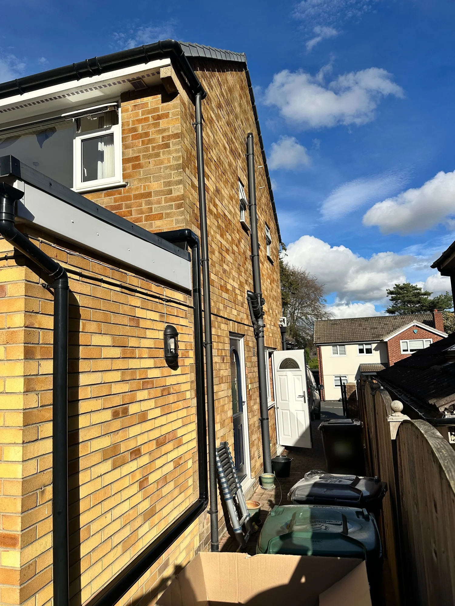 Discreet air conditioning pipework run neatly down an exterior wall