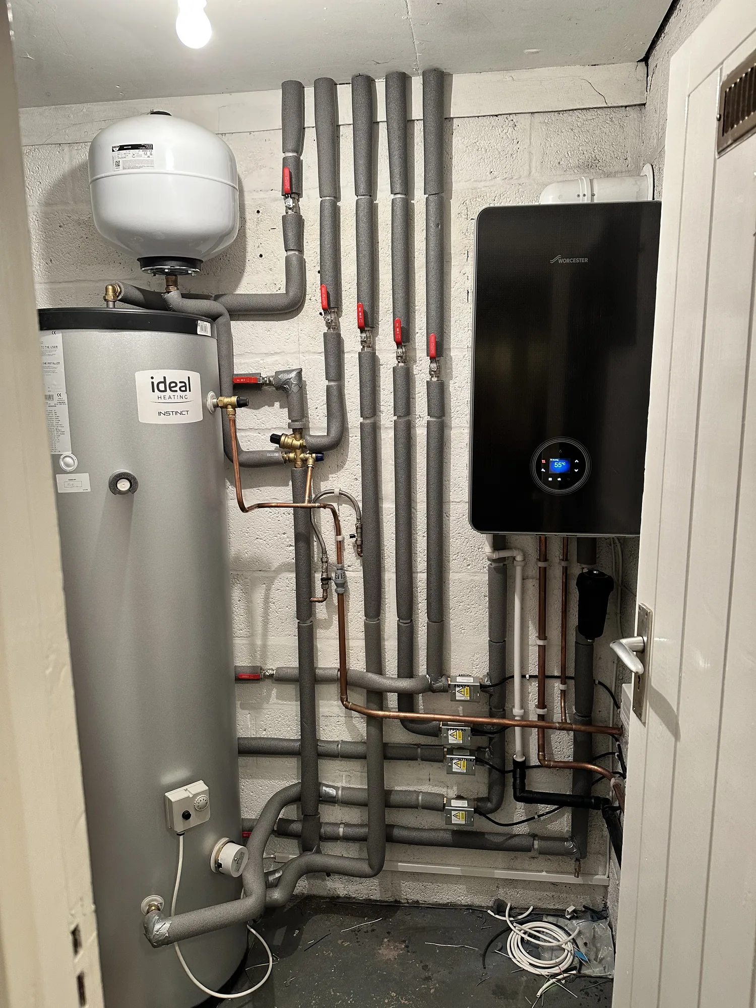 Gas boiler with an unvented hot water cylinder and pipework